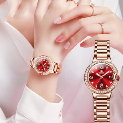 Close-up of a woman's hands elegantly showcasing the Crimson Elegance Waterproof Ladies' Watch with a red dial and rose gold band.