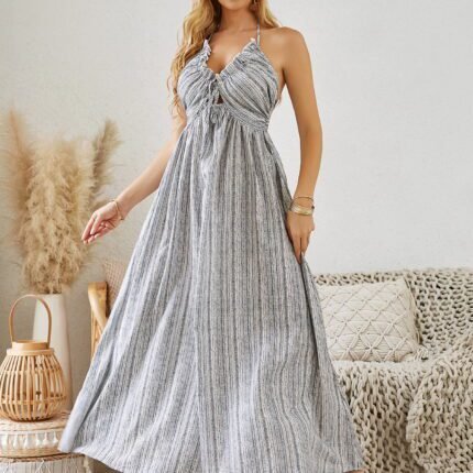 Bohemian Halter Maxi Dress in a striped pattern, featuring a halter neckline and flowy silhouette.