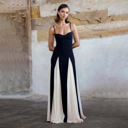 Black and white flare maxi dress with a fitted bodice and flowing contrast skirt for elegant evening wear