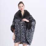 Woman wearing a gray leopard-print faux fur coat with a plush shawl collar