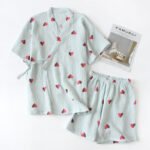 "Pink heart-print cotton lounge set with relaxed top and shorts." "Classic navy blue cotton lounge set with wrap-style top and elastic shorts."