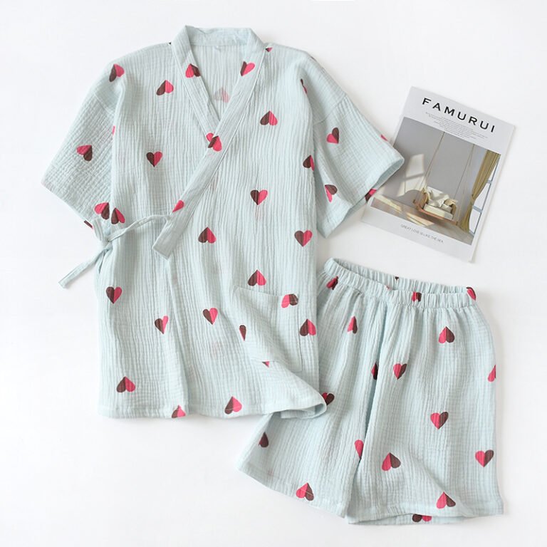 "Pink heart-print cotton lounge set with relaxed top and shorts." "Classic navy blue cotton lounge set with wrap-style top and elastic shorts."