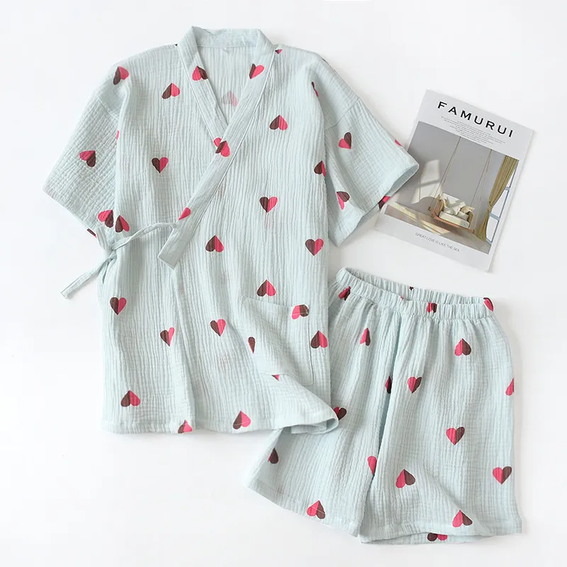 "Pink heart-print cotton lounge set with relaxed top and shorts." "Classic navy blue cotton lounge set with wrap-style top and elastic shorts."