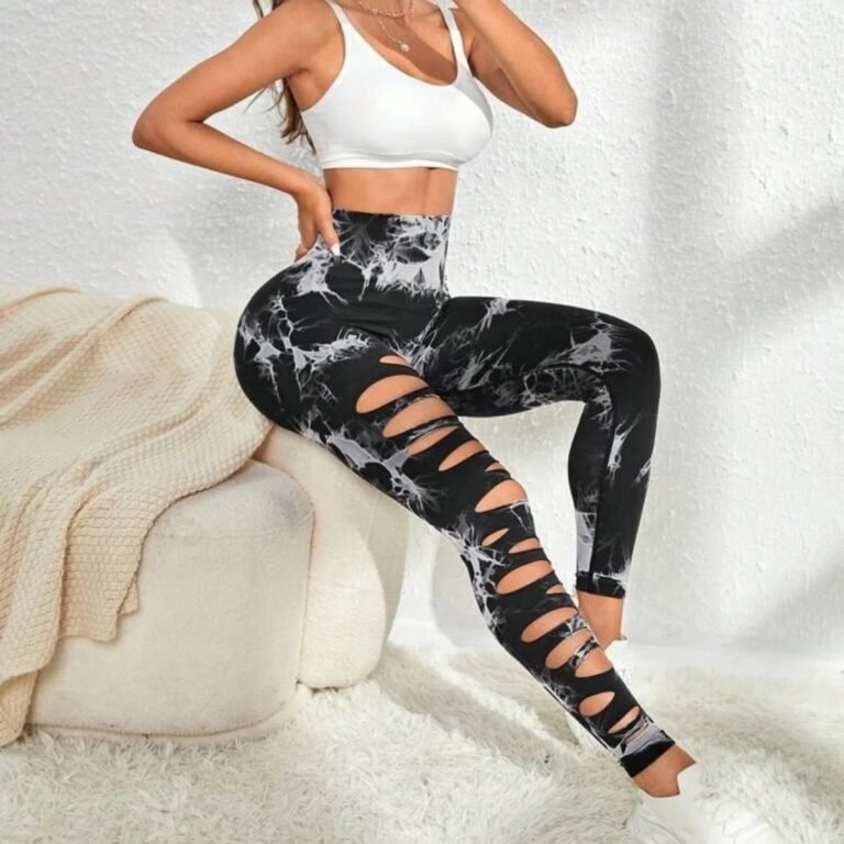High-waisted tie-dye ripped leggings with bold cutouts in vibrant colors.