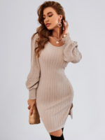 Woman wearing a knitted backless sweater dress with lace detailing and high waist