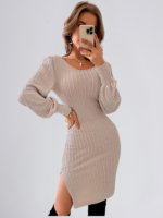 Woman wearing a knitted backless sweater dress with lace detailing and high waist