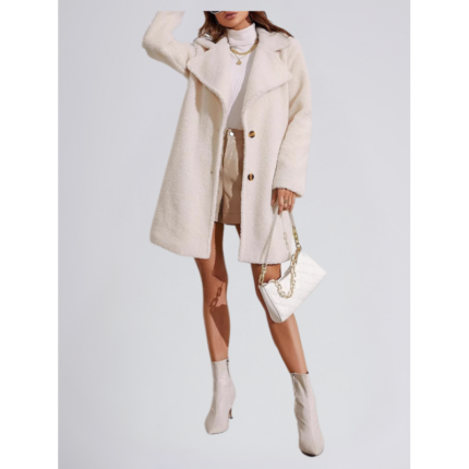 Model wearing an off-white teddy wool coat with a button-front design and wide lapels, styled with a turtleneck and boots.