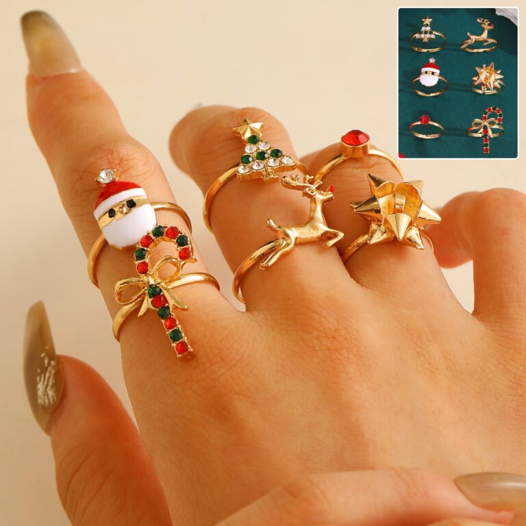 "Festive holiday charm ring set with six Christmas-themed adjustable gold-tone rings."