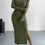 Model wearing a fitted olive green ribbed knit midi dress with a high neckline and side slit