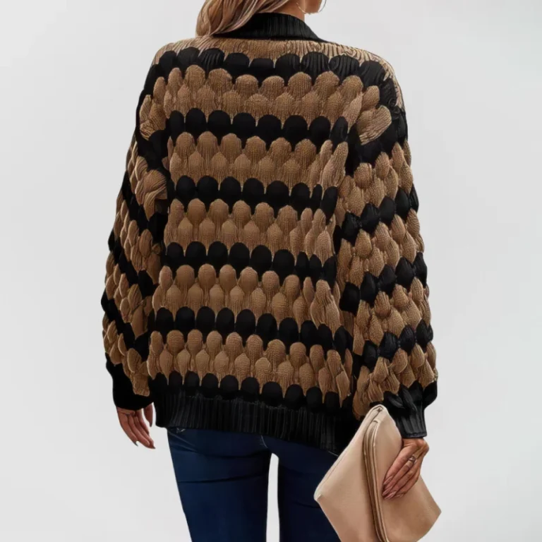 Oversized knit cardigan with textured bubble-knit pattern, styled with casual jeans. brown-with-black