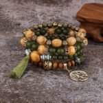 "Handcrafted boho bracelet set featuring wooden beads, tassels, and a Tree of Life charm in vibrant colors."
