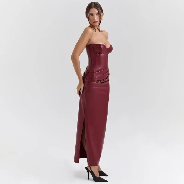 Bordeaux faux-leather bustier midi dress with sweetheart neckline and side slit, styled in a luxurious library setting