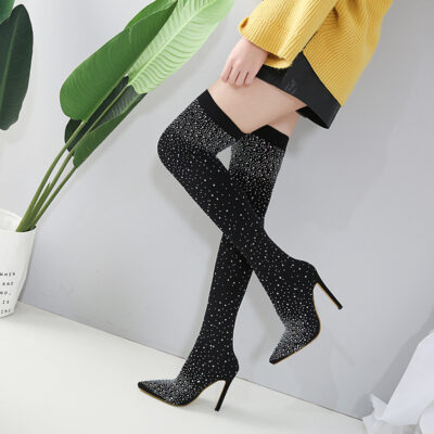 "Black crystal-studded over-the-knee boots with stiletto heels."