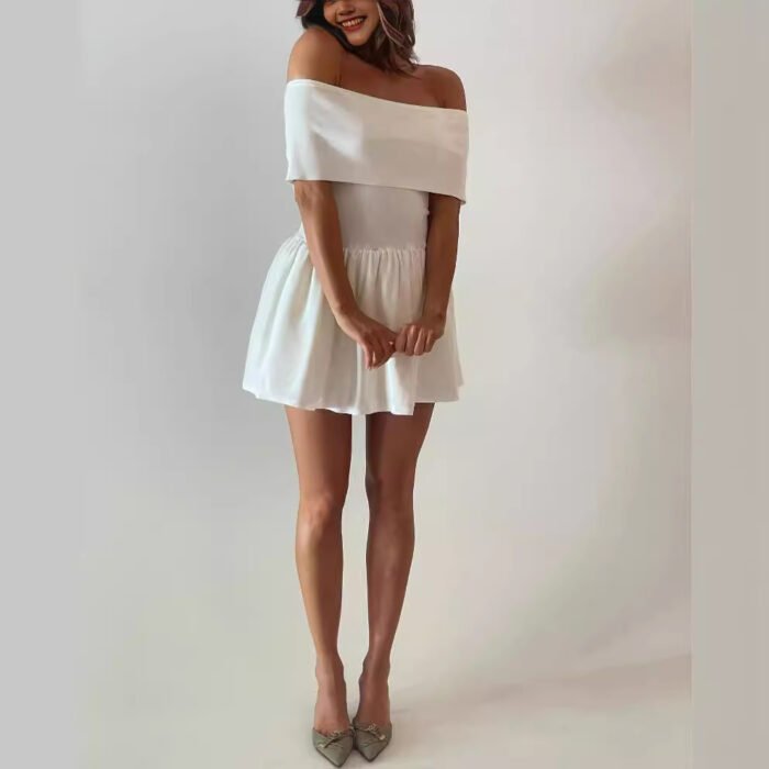Woman wearing an off-shoulder mini dress in white/pink, styled elegantly.