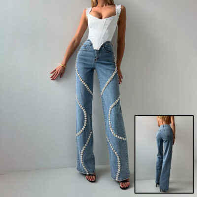 Pearl-embellished wide-leg jeans with wavy design on a model wearing a white corset top.