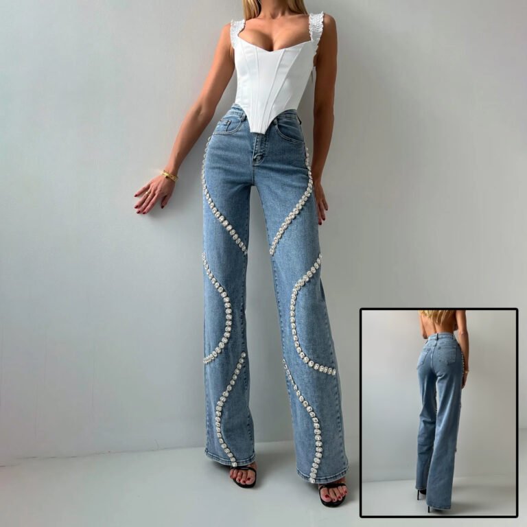 Pearl-embellished wide-leg jeans with wavy design on a model wearing a white corset top.
