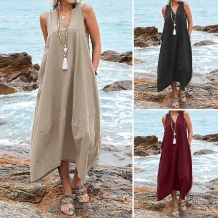 Model wearing a flowy lace-up back maxi dress in black, burgundy, and beige, styled with boho sandals by the beach.