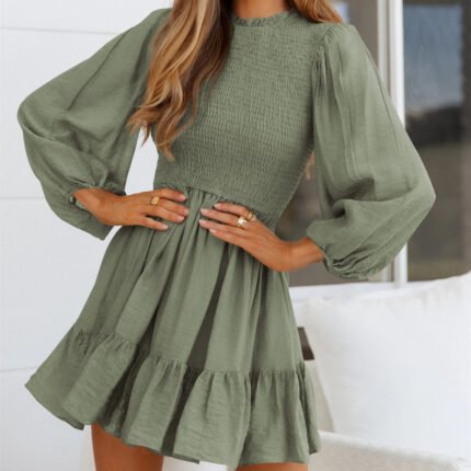 Elegant smocked mini dress with puff sleeves, a ruffle hem, and a flattering waistline, available in Emerald Green, Wine Red, Sage Green, and Lavender.