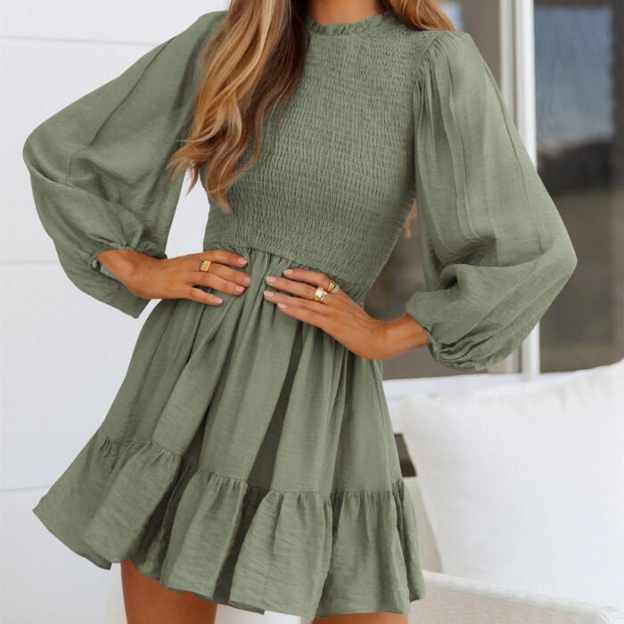 Elegant smocked mini dress with puff sleeves, a ruffle hem, and a flattering waistline, available in Emerald Green, Wine Red, Sage Green, and Lavender.