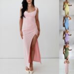 Model wearing a pastel maxi dress with a high side slit and open-back tie detail in multiple colors.