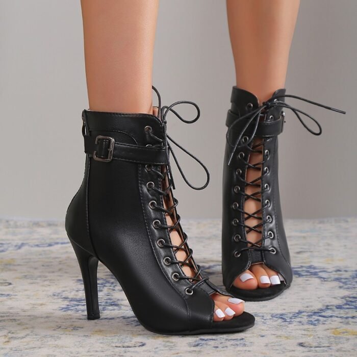 Black lace-up peep-toe stiletto ankle boots with buckle detail and faux leather finish—perfect for a bold fashion statement.