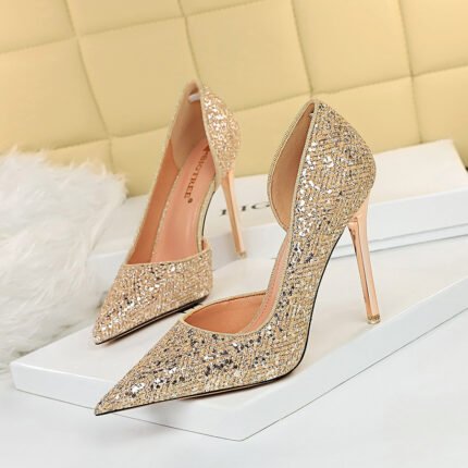 Sparkling glitter stiletto heels with a pointed-toe design and metallic finish—available in silver and gold for a glamorous statement.