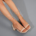 Black lace-up block heel sandals with wraparound ankle ties Beige suede square-toe heels with cross ankle straps