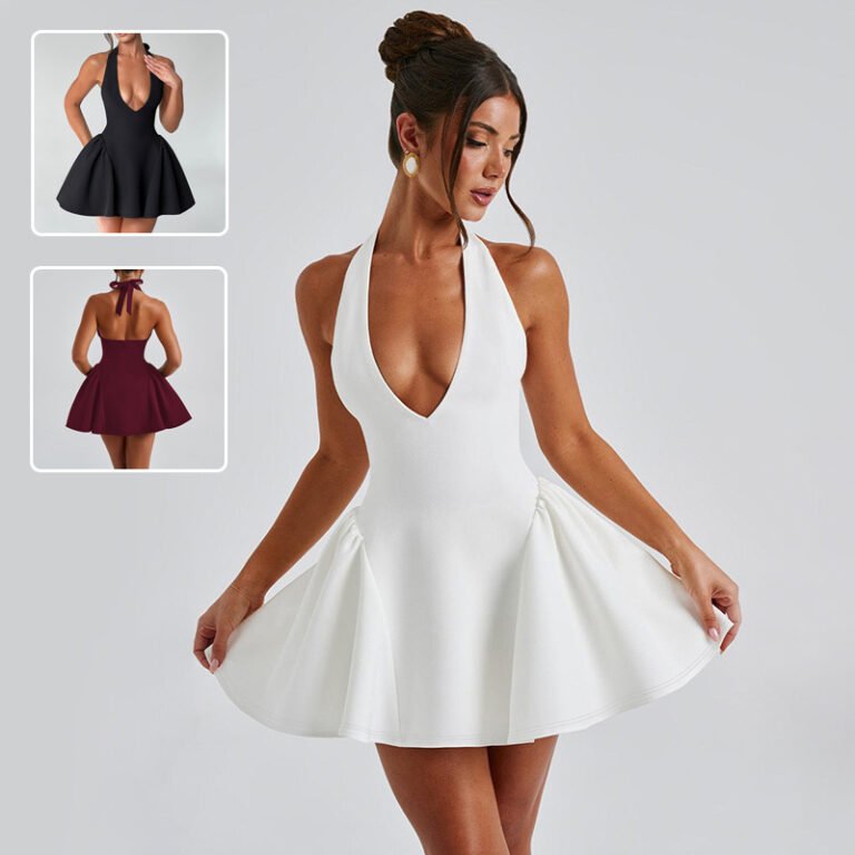 Woman in white deep V halter flare mini dress posing confidently
