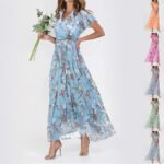 Model wearing light blue floral chiffon maxi dress with flutter sleeves and silver heels