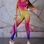 Model wearing high-waisted gradient mesh print leggings in pink, yellow, and blue