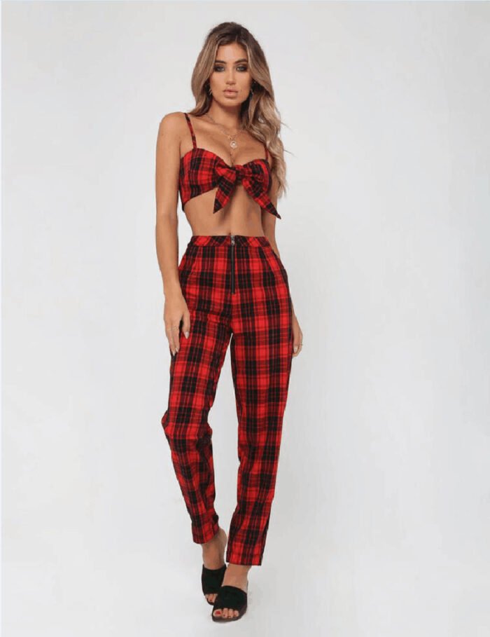 Models wearing plaid high-waisted pants in black and white checkered, red plaid, and yellow tartan prints, paired with white sneakers.