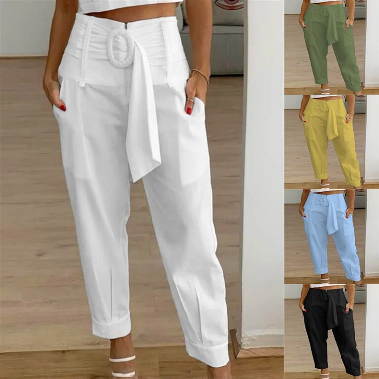 Woman wearing white belted pleated pants