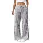 Black striped wide-leg drawstring pants styled with white sneakers