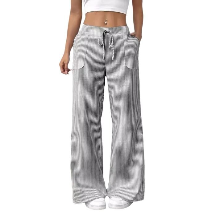 Black striped wide-leg drawstring pants styled with white sneakers