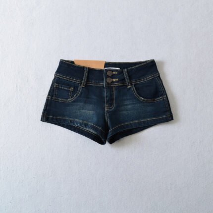 Model wearing ultra-short denim shorts and black tank top