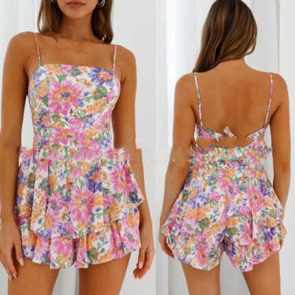 Front view of a floral ruffle romper with spaghetti straps