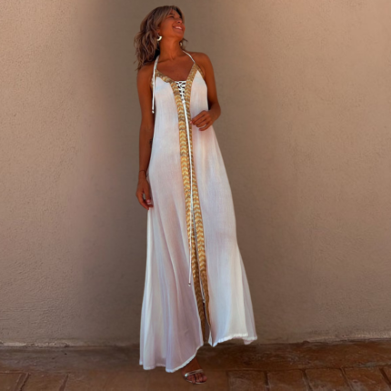 Women’s flowing backless maxi dress with gold trim detailing and halter neckline in ivory white and red.