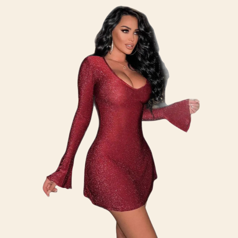 Model wearing a red glitter mini dress with a deep scoop neckline, fitted silhouette, long sleeves, and flared bell cuffs.