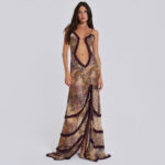 Model wearing a ruffle cutout maxi dress with a plunging front, delicate halter straps, ruched waist, and flowing floor-length skirt.