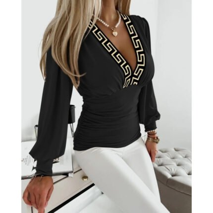 Black fitted V-neck long sleeve top with contrasting neckline detail.